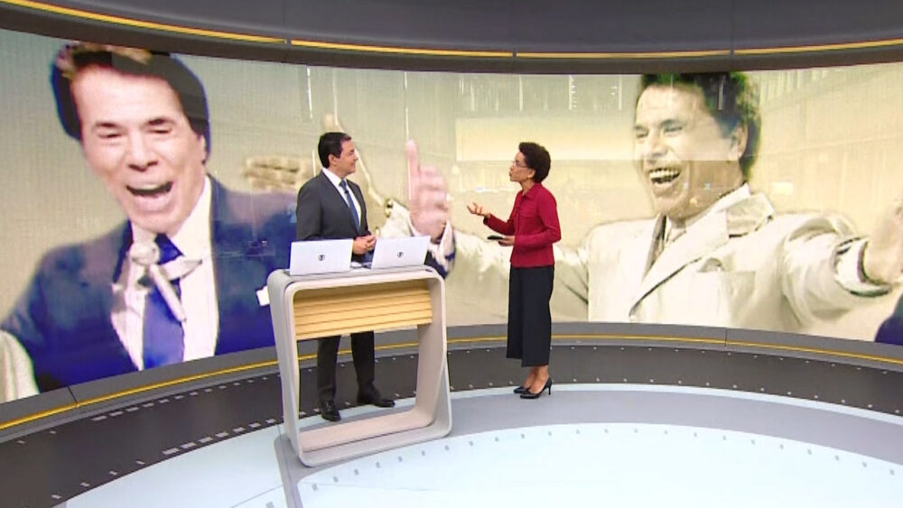 Alan Severiano e Zileide Silva durante apresentação do Jornal Hoje especial sobre Silvio Santos