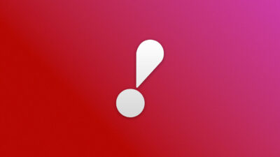 Logotipo da RedeTV! em branco sobre um fundo com degradê em tons de vermelho e rosa