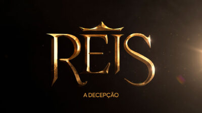 Logo da novela Reis - A Decepção com letras douradas e coroa sobre a letra E, em fundo escuro com efeito de luz
