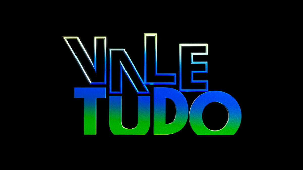 Logo da novela Vale Tudo com letras metálicas em tons de azul e verde