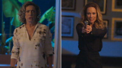 Berta olhando assustada e Ísis apontando arma em cena da novela Mania de Você