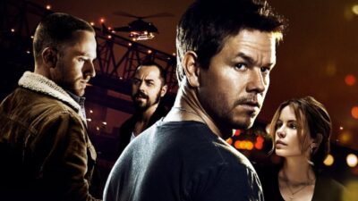 Elenco do filme Contrabando composto por Mark Wahlberg, Kate Beckinsale, Ben Foster e Giovanni Ribisi sob luz dramática e helicóptero ao fundo em ponte