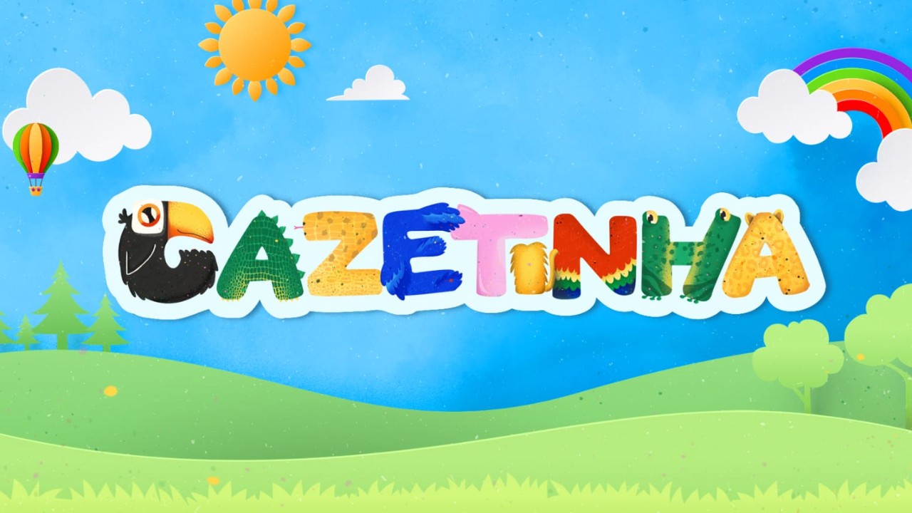 Logotipo Gazetinha com letras coloridas em formato de animais como tucano, jacaré e arara sob céu azul com sol, nuvens, arco-íris e colinas verdes