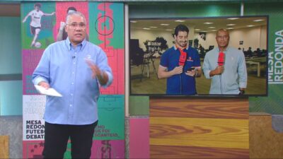 Osmar Garraffa apresenta o Mesa Redonda da Gazeta no estúdio com telão exibindo dois repórteres com microfones em link ao vivo